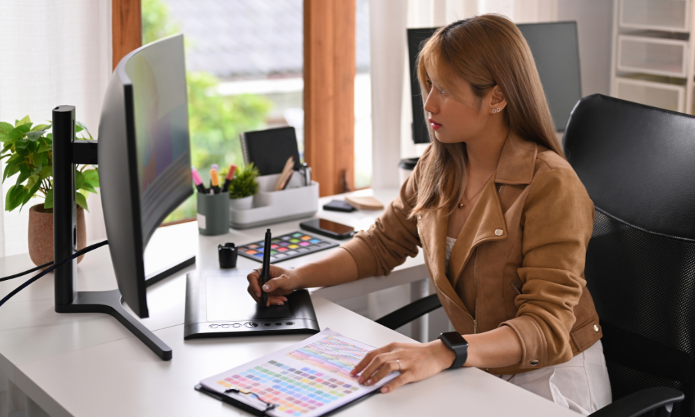Female web designer making notes