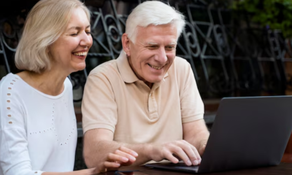 Daughter and father searching online for senior living homes