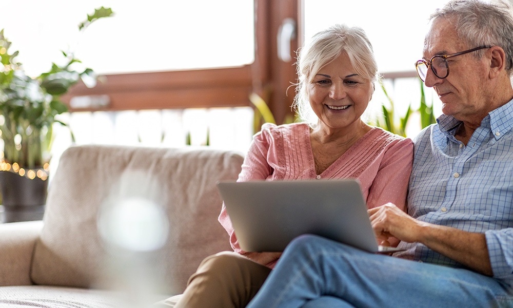 Senior couple looking at computer
